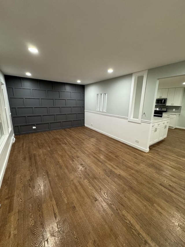 basement with dark wood-type flooring