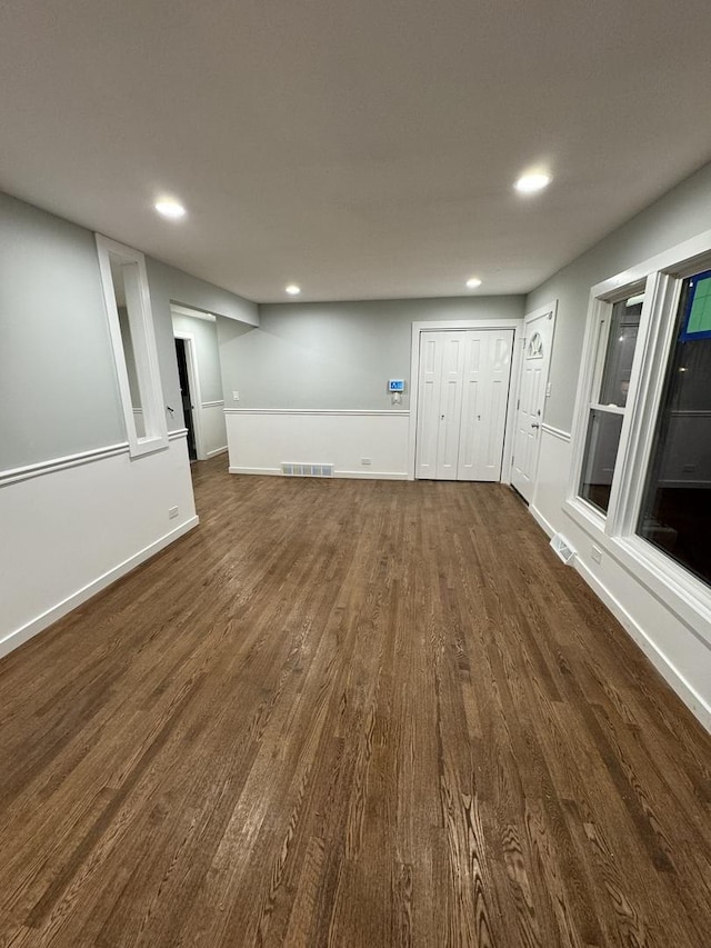 basement featuring dark hardwood / wood-style flooring