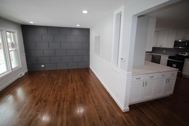 corridor with dark wood-type flooring