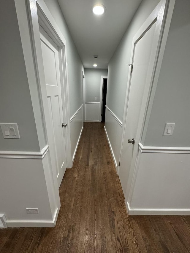 hall with dark hardwood / wood-style floors