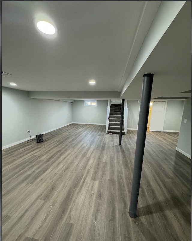 basement featuring hardwood / wood-style floors