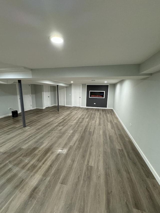 basement with dark wood-type flooring