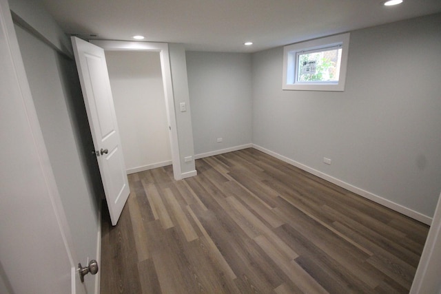 basement featuring dark hardwood / wood-style flooring