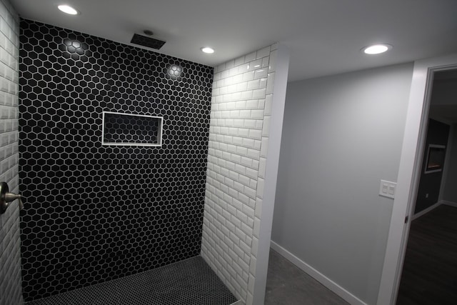 interior space with tiled shower