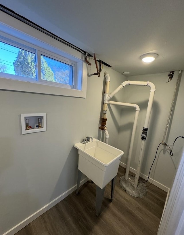 clothes washing area with washer hookup and dark hardwood / wood-style floors