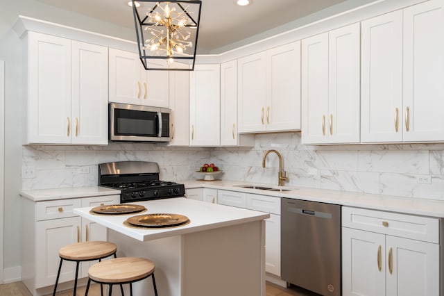 kitchen with white cabinetry, sink, and appliances with stainless steel finishes