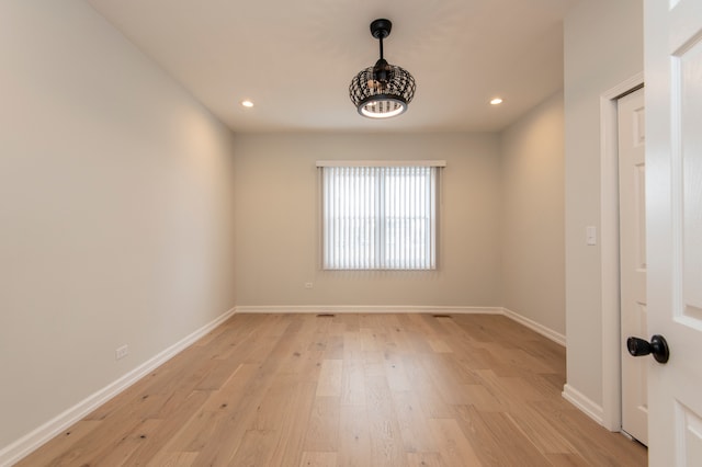 spare room featuring light hardwood / wood-style floors