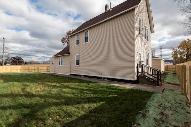 view of property exterior with a lawn