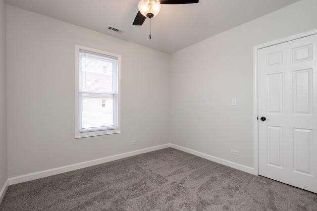 carpeted empty room with ceiling fan