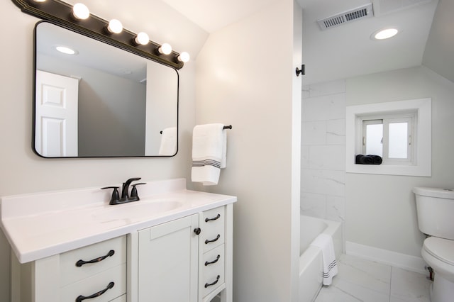 full bathroom featuring vanity, toilet, lofted ceiling, and tiled shower / bath combo