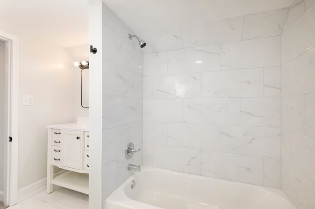 bathroom with vanity and tiled shower / bath