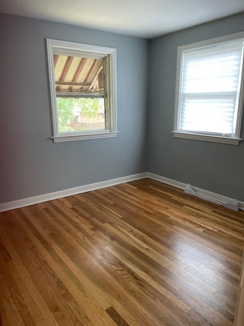 unfurnished room featuring wood-type flooring