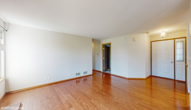 empty room featuring wood-type flooring