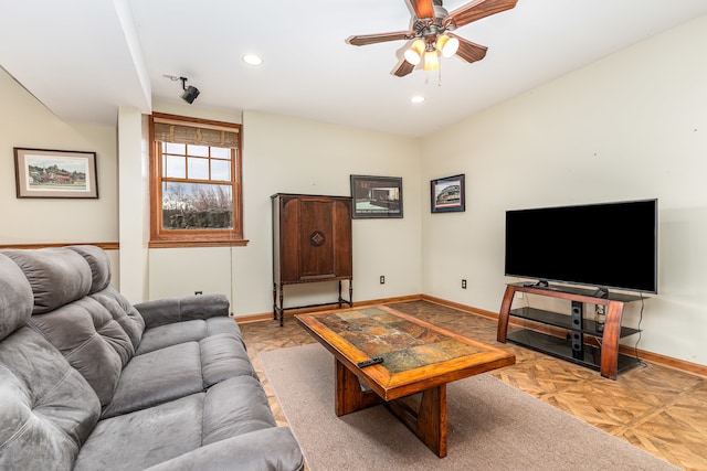 living room with ceiling fan and light parquet flooring