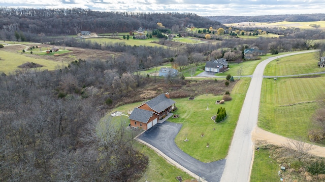 birds eye view of property with a rural view