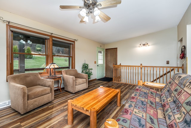 living room featuring wood-type flooring and ceiling fan