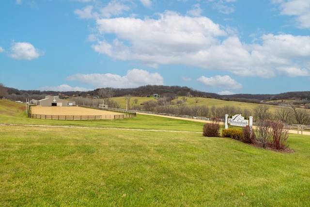 exterior space with a rural view and a yard