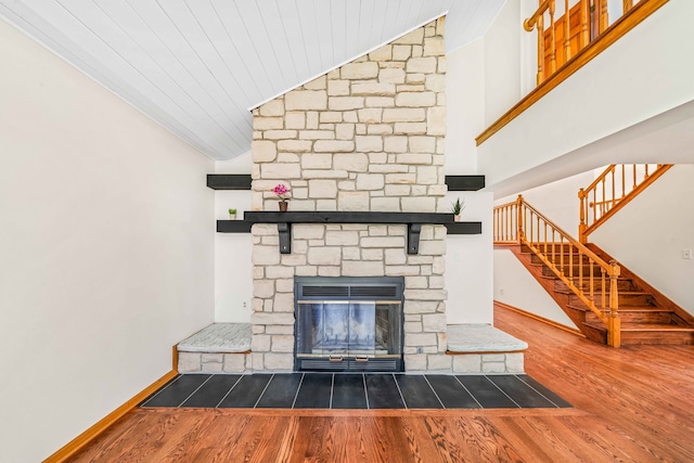 unfurnished living room with wood-type flooring, a fireplace, and wood ceiling