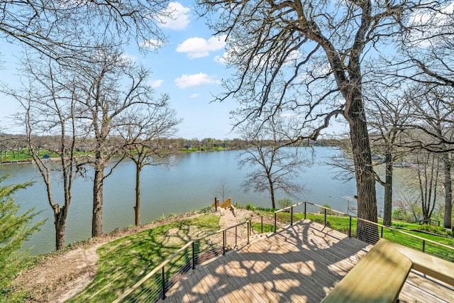 wooden deck featuring a water view