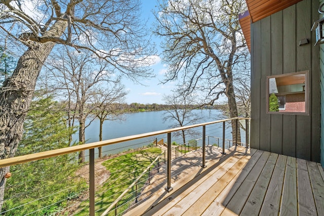 wooden deck featuring a water view