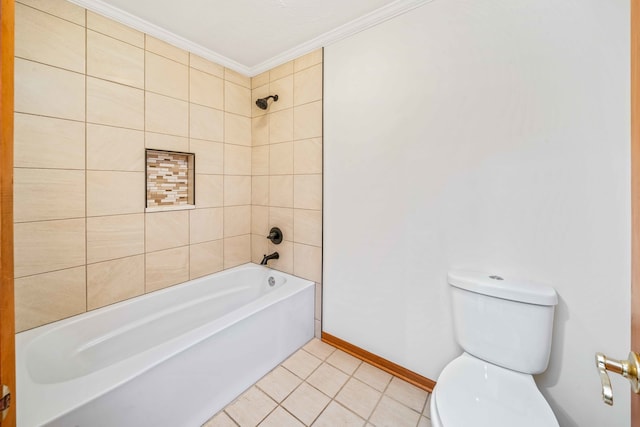 bathroom with tile patterned floors, toilet, tiled shower / bath combo, and ornamental molding