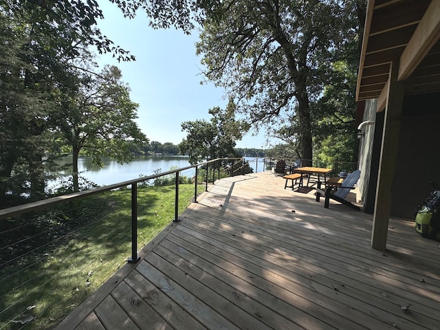 wooden terrace with a water view