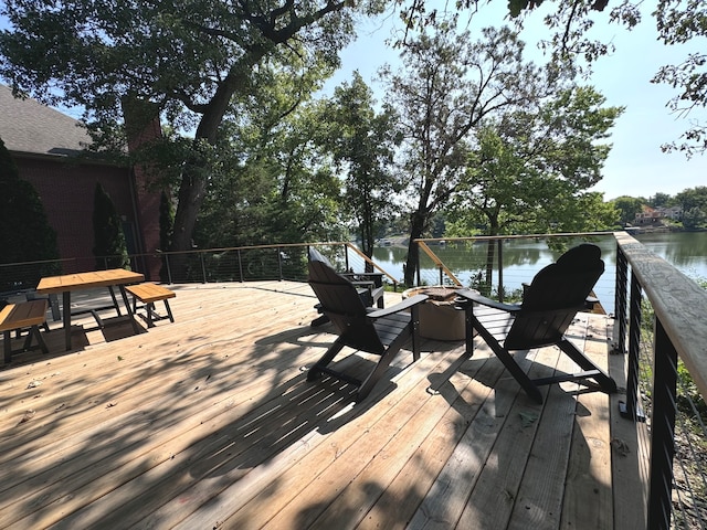 wooden terrace with a water view