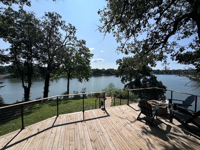 wooden terrace with a water view