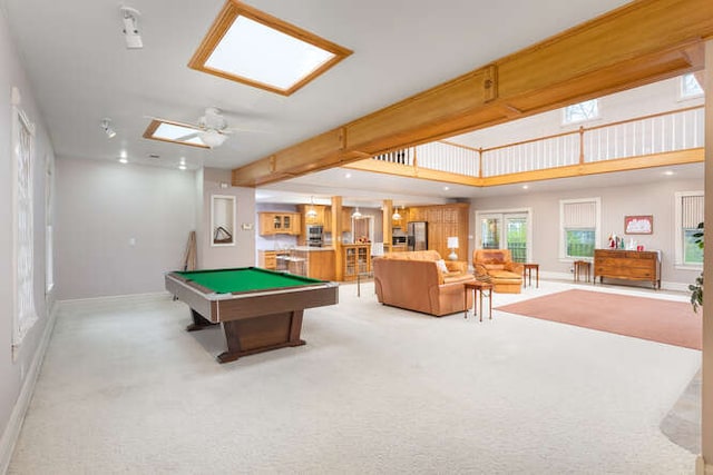 game room with beamed ceiling, ceiling fan, light carpet, and billiards