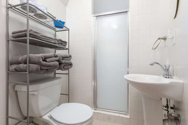 bathroom with toilet and walk in shower