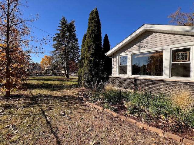 view of side of property featuring a yard