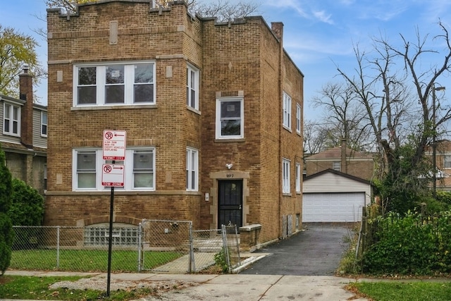 view of front of house featuring a garage and an outdoor structure