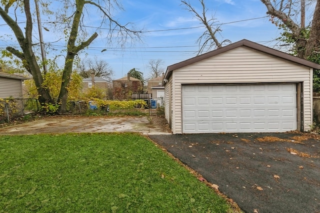 garage featuring a lawn