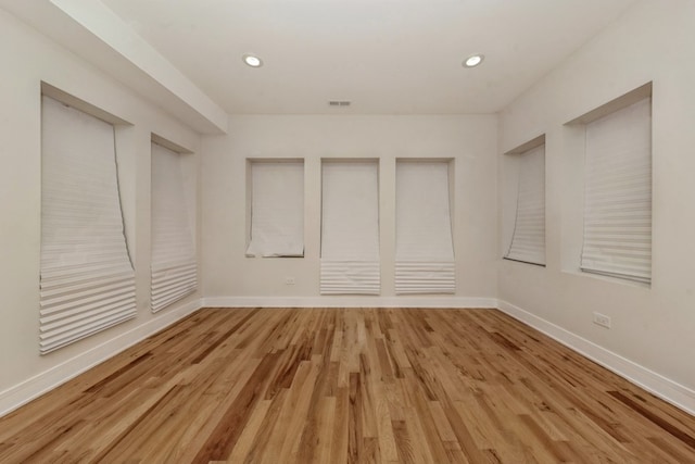 unfurnished room featuring hardwood / wood-style floors