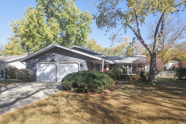 ranch-style house with a front yard and a garage