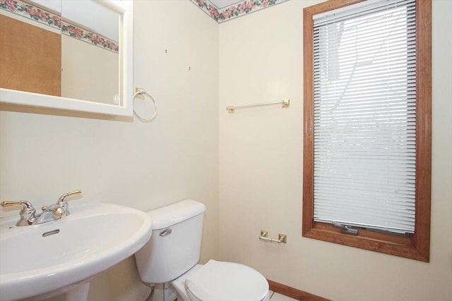 bathroom with sink and toilet