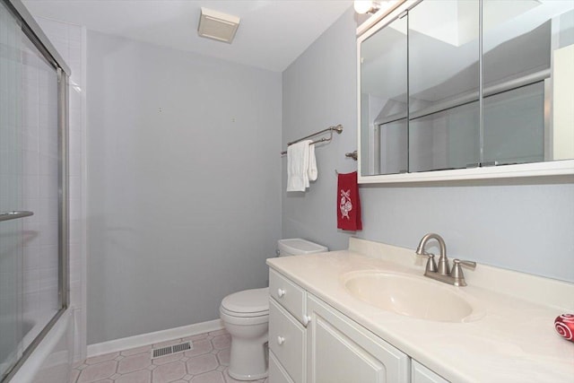 full bathroom with tile patterned flooring, vanity, toilet, and enclosed tub / shower combo