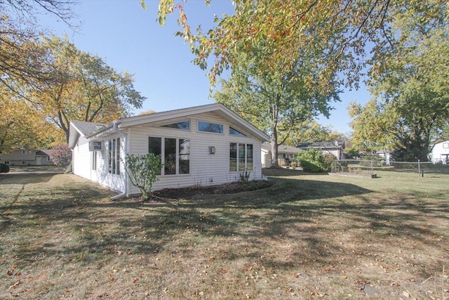 view of side of home featuring a yard