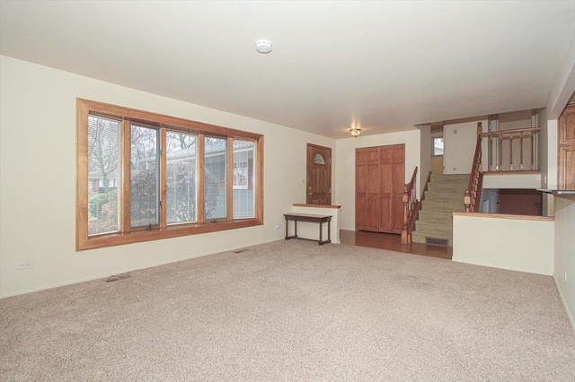 unfurnished living room with carpet