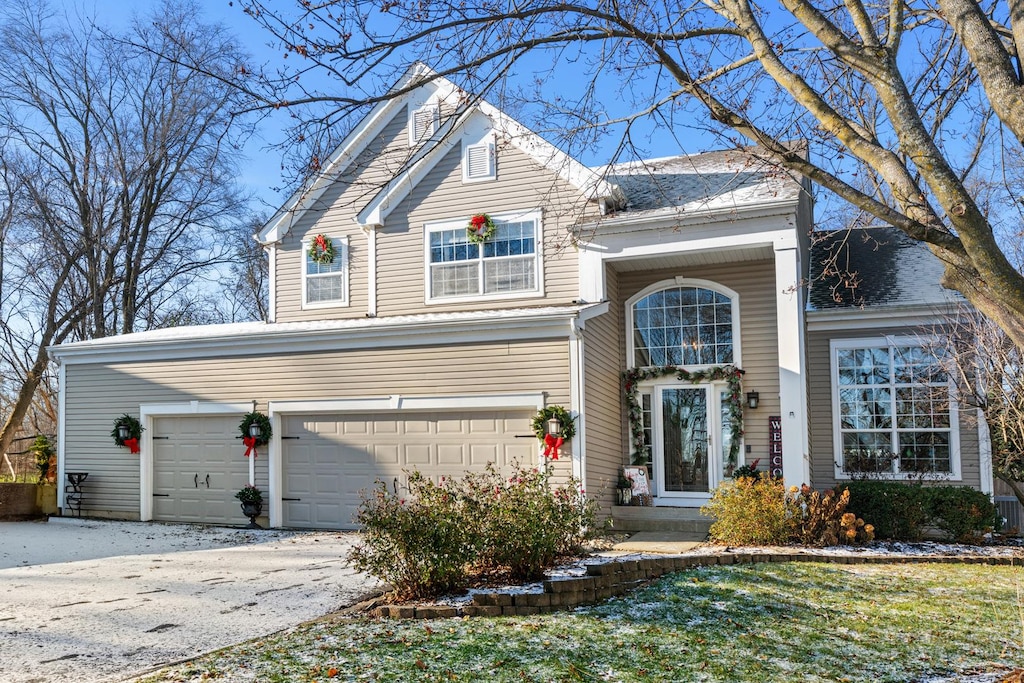 front of property with a garage