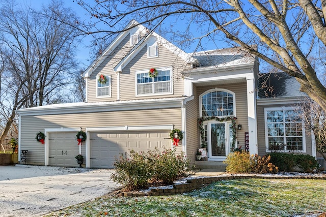 front of property with a garage