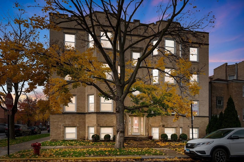 view of outdoor building at dusk