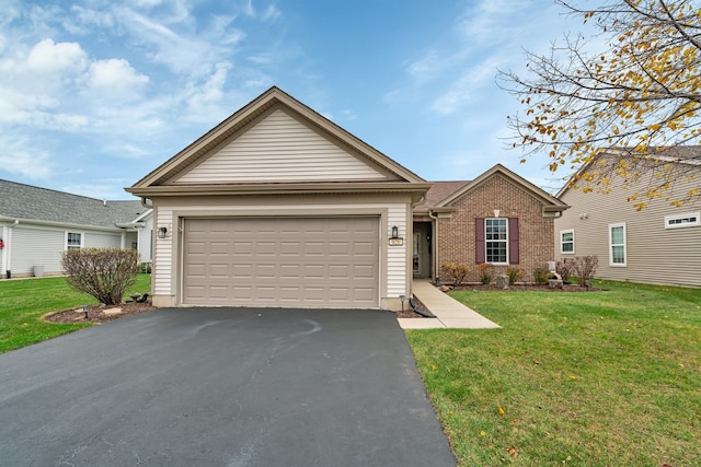 view of front of home featuring a garage and a front lawn