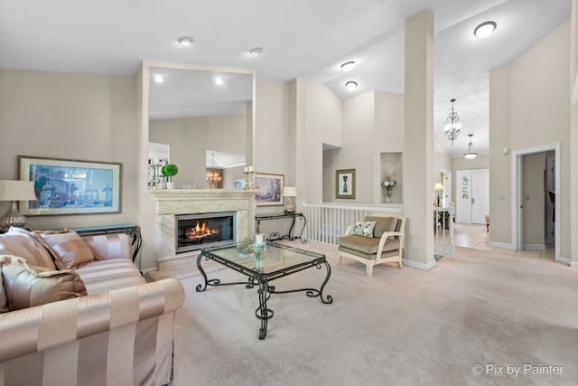 carpeted living room with a premium fireplace and high vaulted ceiling