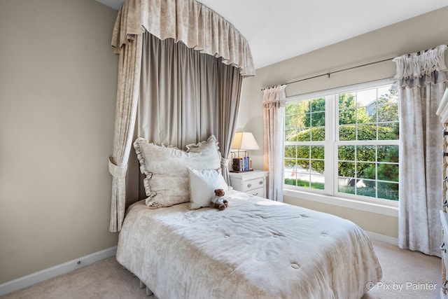 bedroom featuring light colored carpet