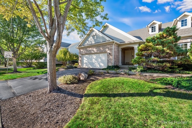 view of front facade featuring a garage and a front lawn