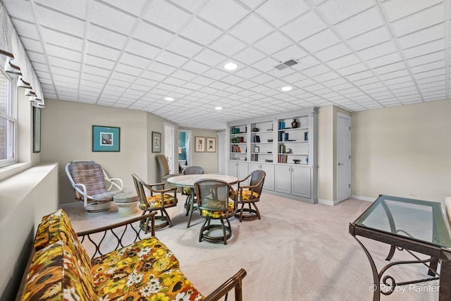 dining space with light colored carpet