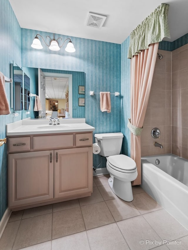 full bathroom with tile patterned floors, toilet, vanity, and shower / bath combo