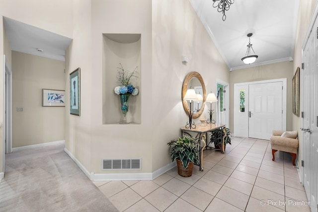 tiled foyer with crown molding