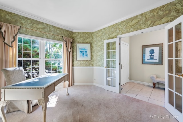 carpeted office with crown molding and french doors